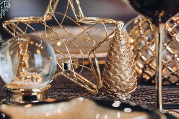 Dining place decorated with toys, glass and plates. New Year eve concept