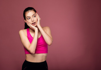 Closeup surprised girl in fitness wear.