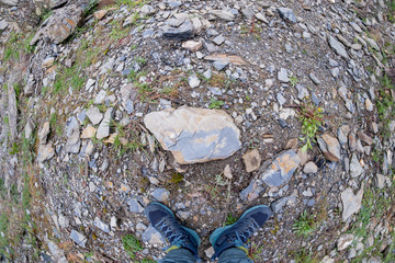 tourist's feet in sports shoes tourism travel concept fish eye