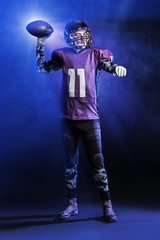 American football player on dark background