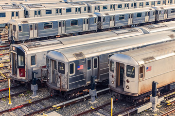 Row of trains in the Maintenance Shop at sunset. City and transportation concept. New York City....