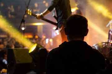 Fototapeta na wymiar The silhouette of spectator near the stage.