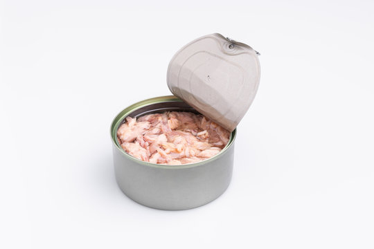 Open canned tuna tin on a white background; copy space, soft light, studio shot