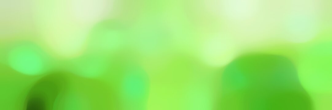 blurred bokeh horizontal background graphic with light green, pastel green and tea green colors and free text space