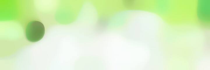 unfocused bokeh horizontal background graphic with beige, pastel green and pale green colors space for text or image