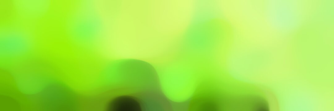 soft unfocused horizontal background graphic with green yellow, moderate green and lawn green colors space for text or image
