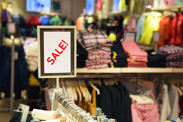 Sale sign inside of clothing store
