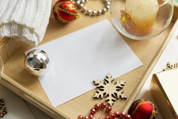 Composition of an empty white christmas card. Festive seasonal decorations, delivery lay flat background template.