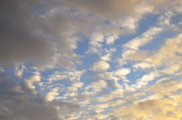 Blue evening sky with clouds. Sunset.