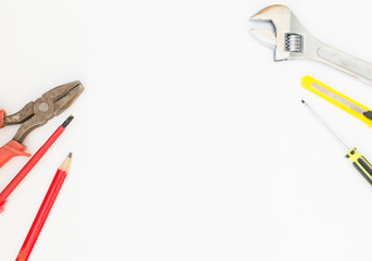 Construction tools - wire cutters and a wrench on a white background