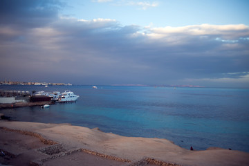 The view of Red sea with ship and cloudly sky before rain in Hurhgada