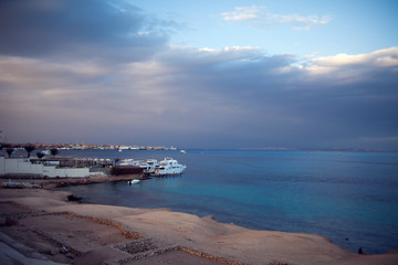 The view of Red sea with ship and cloudly sky before rain in Hurhgada
