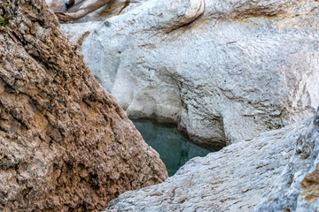 Fall landscape with quick narrow mountain river with clean water
