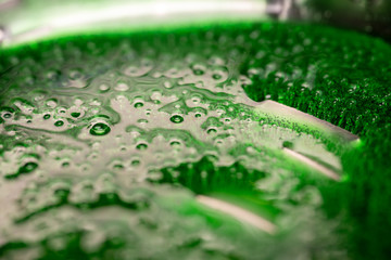 boiling hot green caramel in a pan photographed in macro