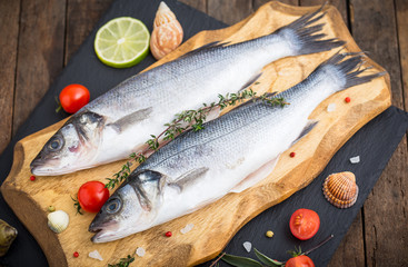 Fresh raw seabass fishon the wooden table
