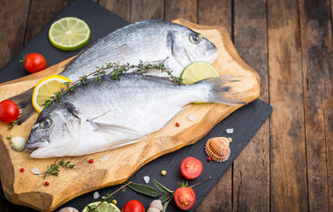 Fresh raw dorado fishon the wooden table