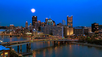 Full moon above Pittsburgh skyline