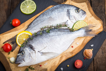 Fresh raw dorado fishon the wooden table