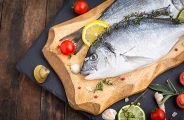 Fresh raw dorado fishon the wooden table