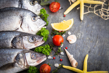 Fresh raw sea fish on the stone background