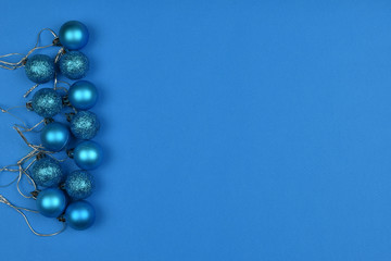 2020 color. The trend of the year. Christmas blue and silver balls on a blue background. Place for an inscription. Card. Christmas.