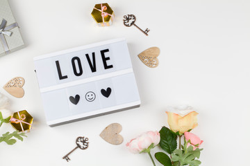 light box with text LOVE, decoration, gift and flower. love confession, happy valentines day