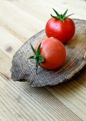 cherry tomatoes on a wooden pedestal