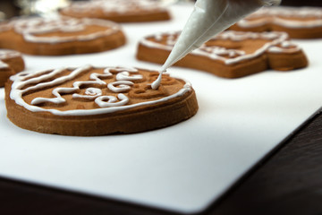 Christmas Ginger and Honey cookies on white surface. Star, fir tree, snowflake shape.