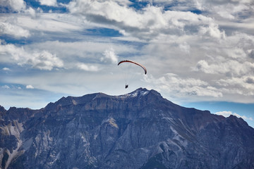 Paragliding in the mountains, in the Stubai Valley, Tyrol, Austria.