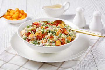 pasta salad with green peas, fried bacon