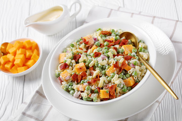 pasta salad with green peas, fried bacon