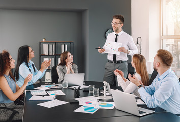 Colleagues discussing issue at business meeting in office