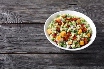 elbow pasta salad with green peas, closeup