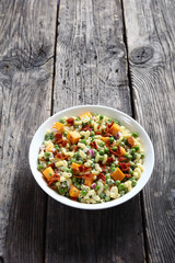 pasta salad with green peas, fried bacon