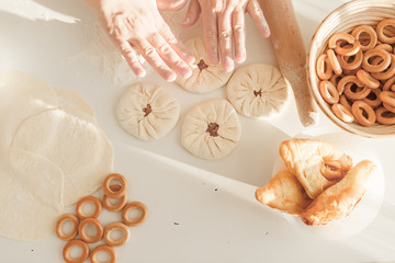 cooking traditional national dish, yeast dough, flour, women hands