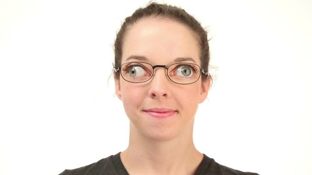 Young woman with independent eye movement, wearing glasses