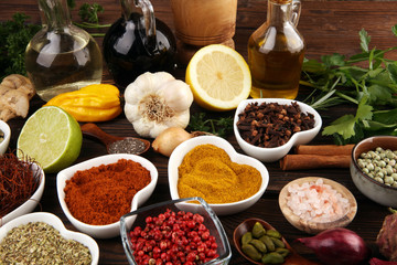 Spices and herbs on table. Food and cuisine ingredients with oil and vinegar
