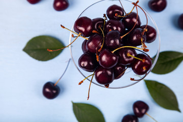Ripe cherries in a glass bowl