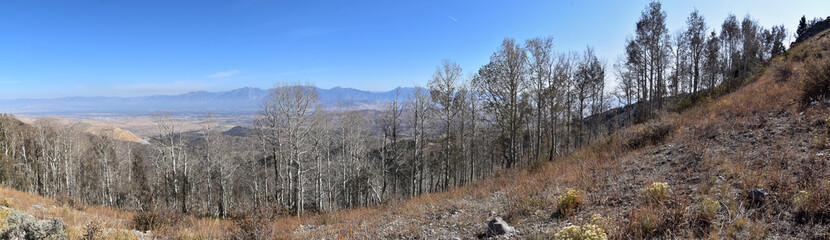 Rocky Mountain Wasatch Front peaks, panorama landscape view from Butterfield canyon Oquirrh range by Rio Tinto Bingham Copper Mine, Great Salt Lake Valley in fall. Utah, United States.
