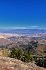 Rocky Mountain Wasatch Front peaks, panorama landscape view from Butterfield canyon Oquirrh range by Rio Tinto Bingham Copper Mine, Great Salt Lake Valley in fall. Utah, United States.