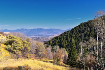 Fototapeta na wymiar Rocky Mountain Wasatch Front peaks, panorama landscape view from Butterfield canyon Oquirrh range by Rio Tinto Bingham Copper Mine, Great Salt Lake Valley in fall. Utah, United States.