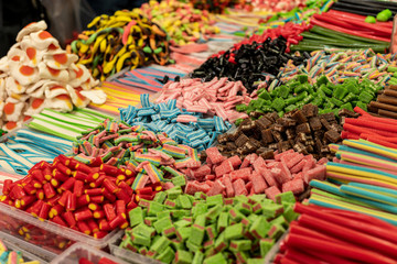 unhealthy but tasty colorful marmalade candies with a lot of sugar food background top view photography of market counter ready for selling