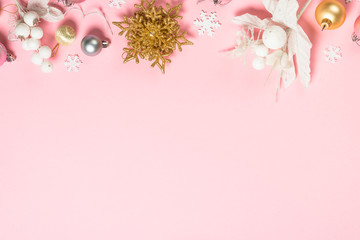 Fototapeta na wymiar Christmas flat lay background on pink with decorations.