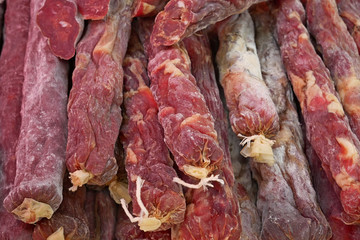 A pile of raw dried sausages