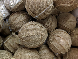 Texture. Christmas tree toys close-up. Burlap balls. Fabric.