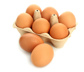 Package with fresh eggs on white background