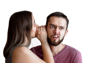 Woman is whispering a secret into her friends ear