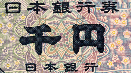 Japanese 1000 yen banknote fragment. Japan currency close up macro. Japan economy, finance.