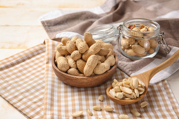 Tasty peanuts on white table