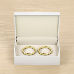 Box with gold wedding rings